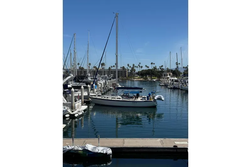 1979 O'Day 37 Center Cockpit sailboat docked in a sunny marina.
