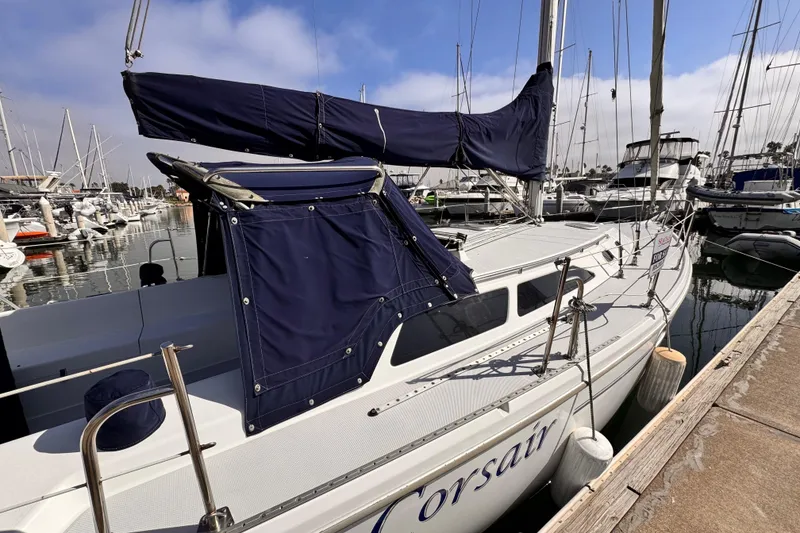 2001 Catalina 36 MkII sailboat docked at marina, featuring blue sail cover.