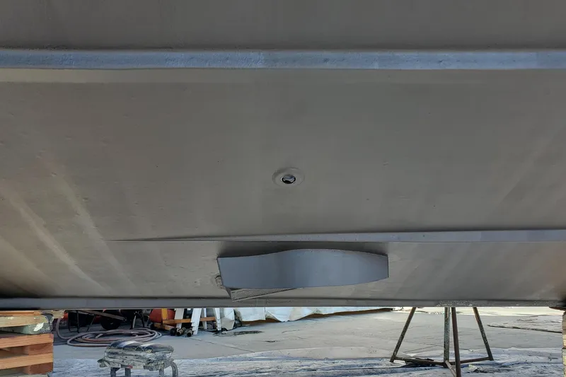 Underside view of a 2000 Silverton 42 Convertible boat on stands.