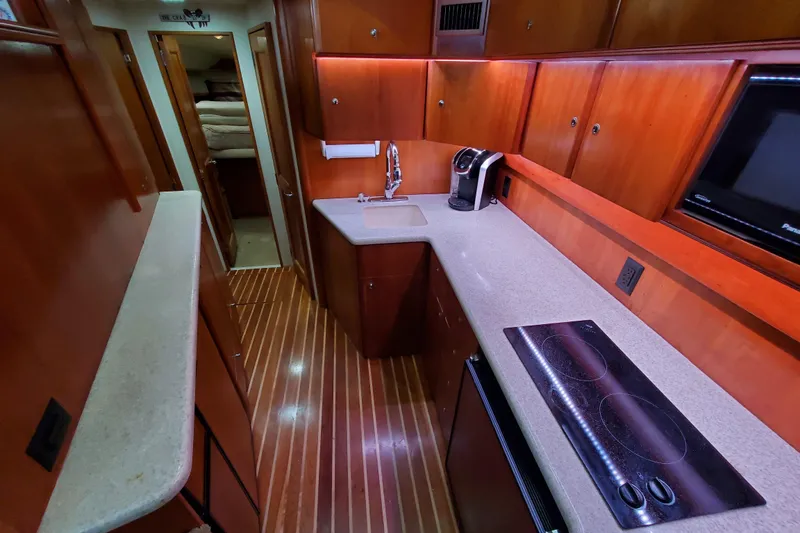 Luxurious galley in 2000 Silverton 42 Convertible yacht with modern amenities.