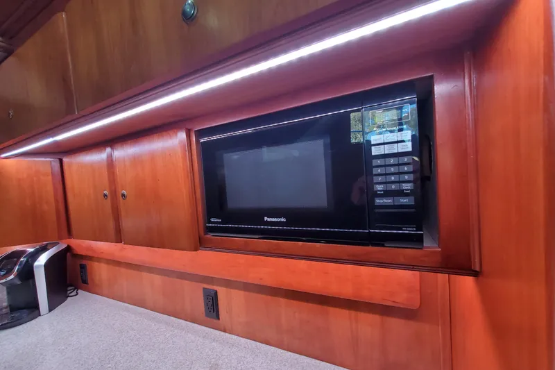Microwave in the kitchen of a 2000 Silverton 42 Convertible yacht.