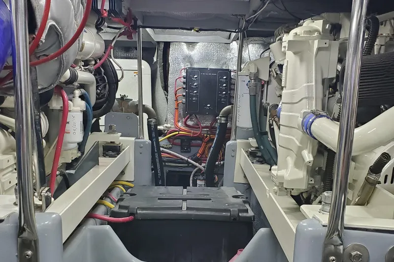 Engine room of a 2000 Silverton 42 Convertible boat, showcasing mechanical components.