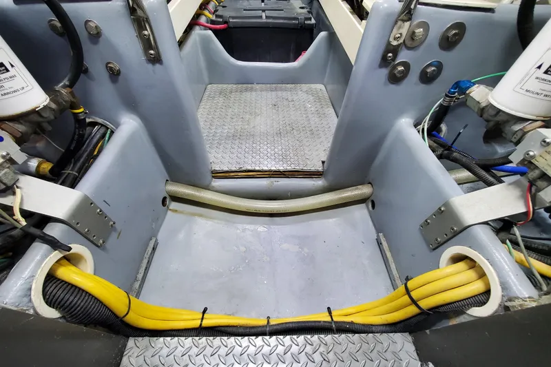 Engine room of a 2000 Silverton 42 Convertible boat, showcasing wiring and components.