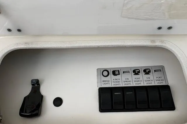 Control panel of a 2000 Silverton 42 Convertible boat with labeled switches.