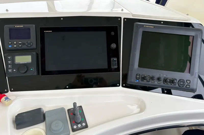 Control panel of a 2000 Silverton 42 Convertible boat with navigation equipment.