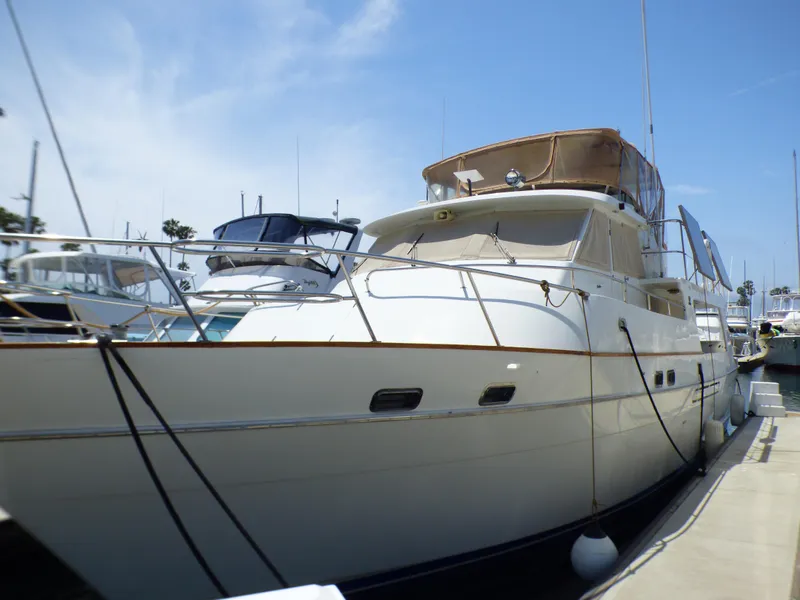 MedYacht Mallorca 50, 1987 model, docked at a marina under a clear blue sky.