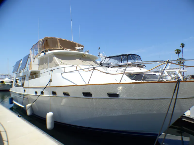1987 MedYacht Mallorca 50 docked at marina under clear blue sky.