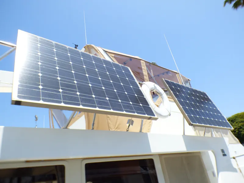 Solar panels on 1987 MedYacht Mallorca 50 under clear blue sky.