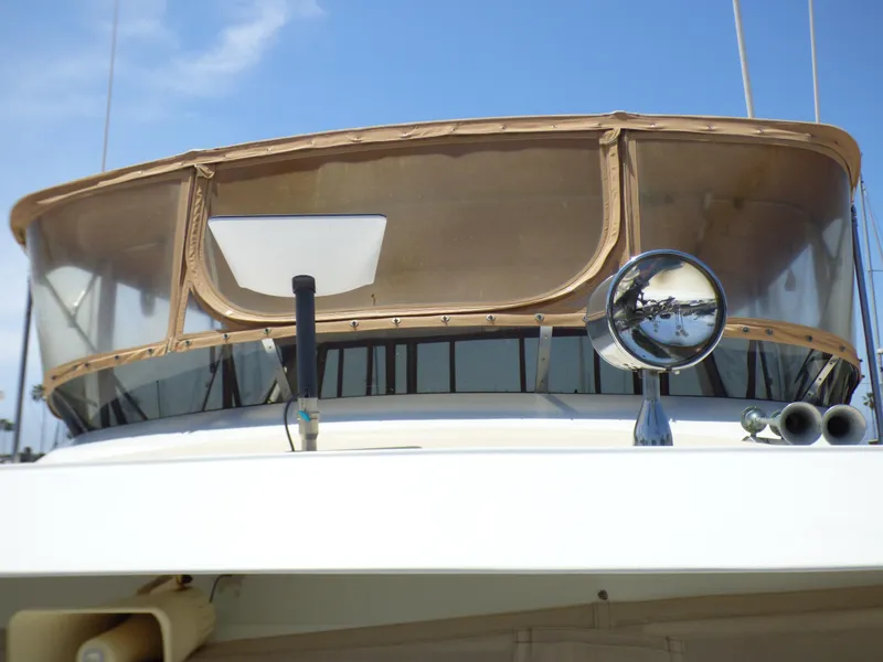 1987 MedYacht Mallorca 50 yacht with beige canopy and chrome spotlight.