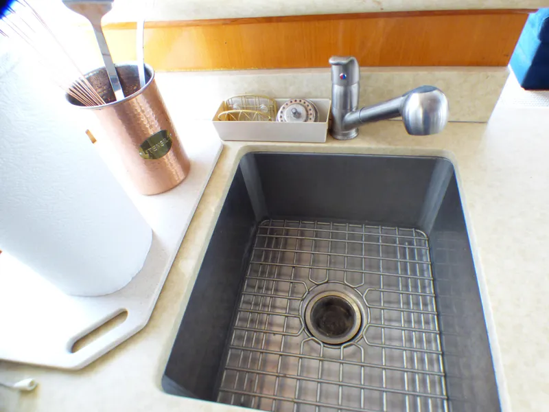 Kitchen sink area on a 1987 MedYacht Mallorca 50, featuring modern fixtures and accessories.
