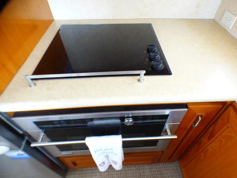 Modern yacht kitchen with stovetop and oven, MedYacht Mallorca 50, 1987 model.
