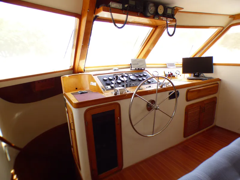 Cockpit of 1987 MedYacht Mallorca 50 with steering wheel and control panel.