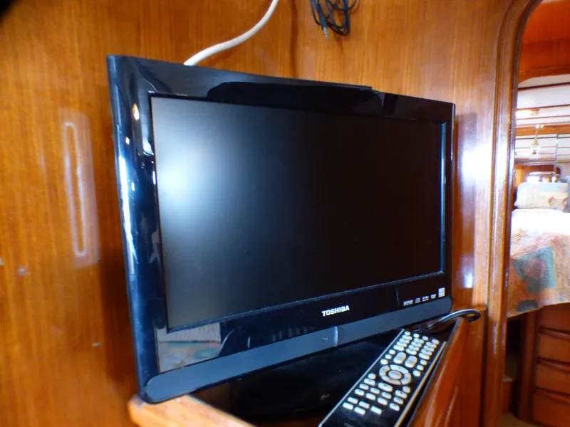Toshiba TV and remote inside 1987 MedYacht Mallorca 50 cabin.