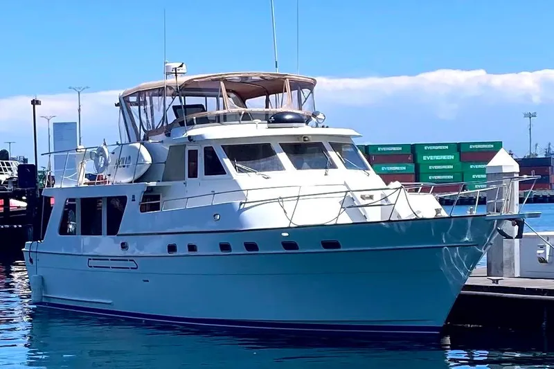 1987 MedYacht Mallorca 50 docked at a marina under clear blue skies.