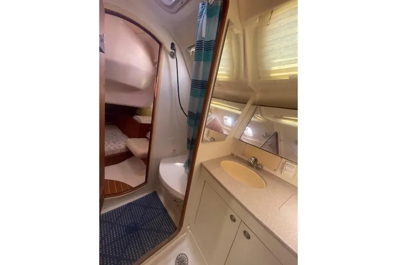 Interior of 2001 Hunter 380 yacht featuring bathroom and cabin area.