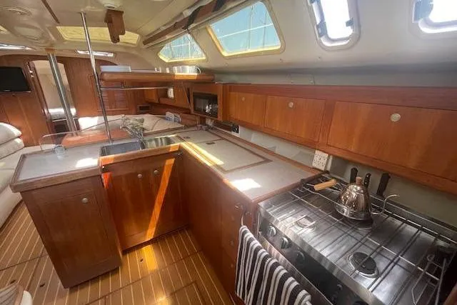 Interior of a 2001 Hunter 380 yacht featuring a well-equipped kitchen area.