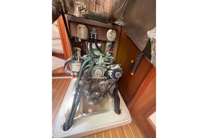 Engine compartment of a 2001 Hunter 380 sailboat, featuring a Yanmar engine.