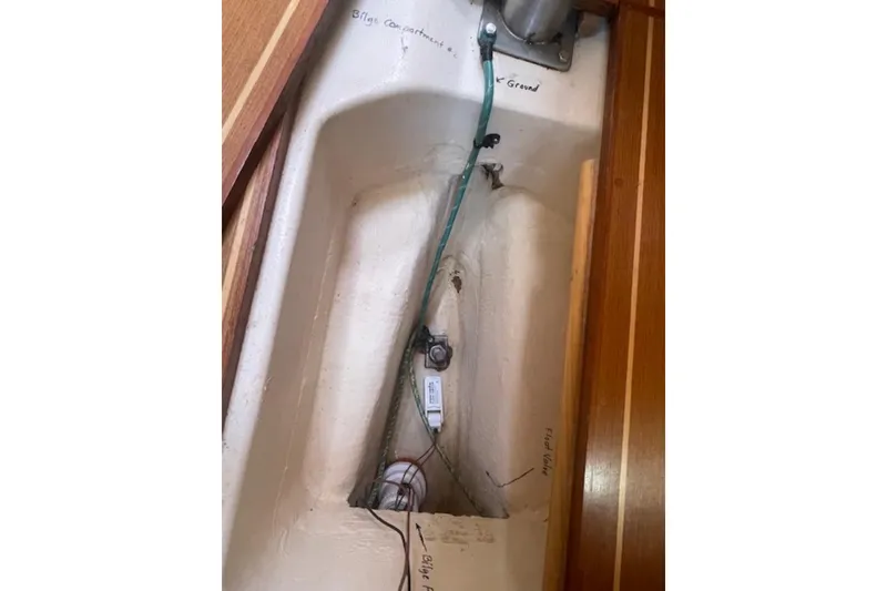 Bilge compartment of a 2001 Hunter 380 sailboat, showing wiring and labeled components.