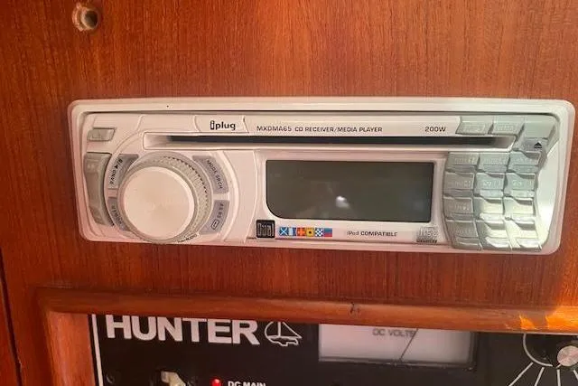 CD receiver and media player in a 2001 Hunter 380 boat interior.
