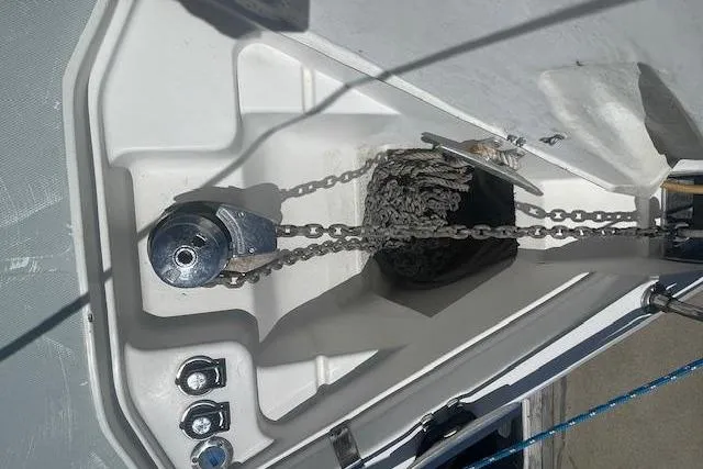 Anchor chain and windlass on a 2001 Hunter 380 sailboat deck.