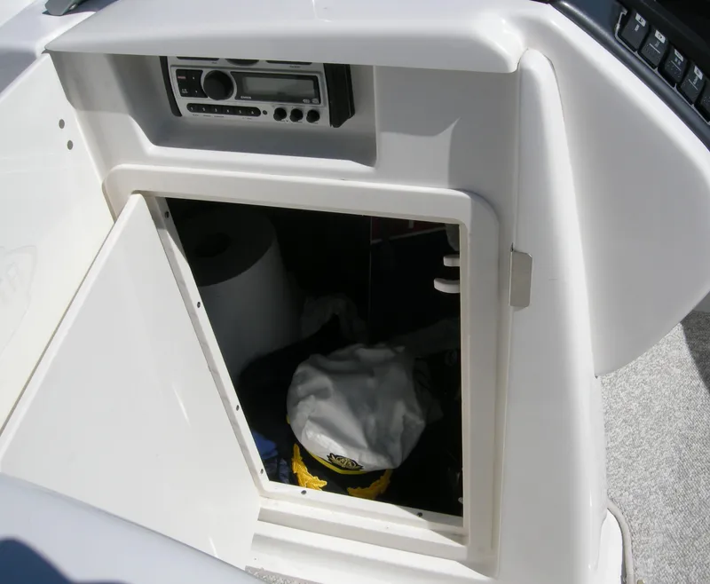 Stowage behind helm