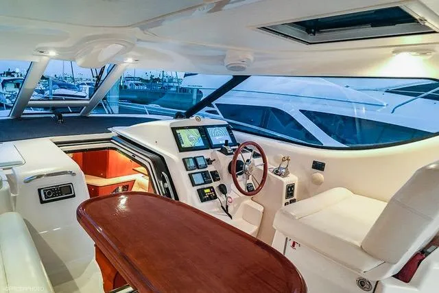 Interior of 2007 Tiara Yachts 4300 Sovran, featuring helm and seating area.