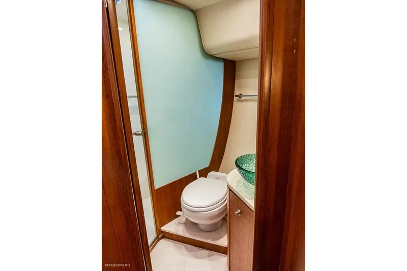 2007 Tiara Yachts 4300 Sovran bathroom with modern design and glass sink.