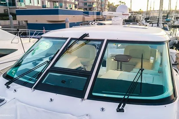 2007 Tiara Yachts 4300 Sovran with sleek windshield and marina backdrop.