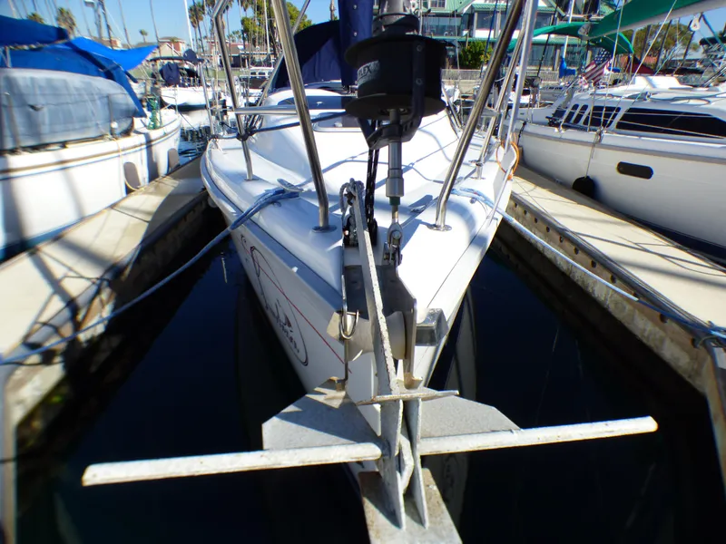 1998 Hunter 34 sailboat docked in marina.