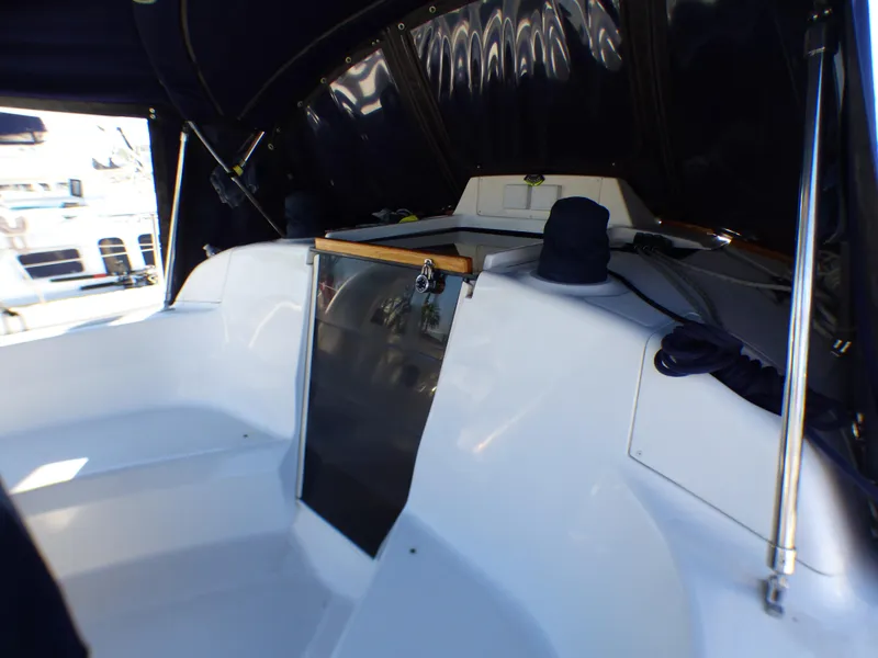 Interior of a 1998 Hunter 34 yacht, featuring a white cockpit.