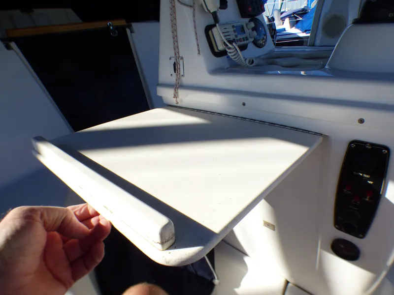 Interior of a 1998 Hunter 34 sailboat with a foldable table.