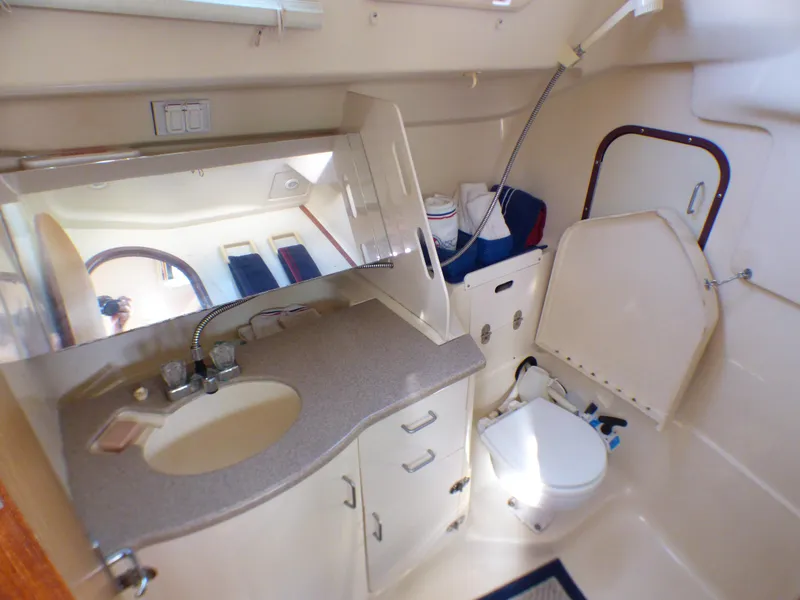 Interior of a Hunter 34 yacht, bathroom with sink and toilet.