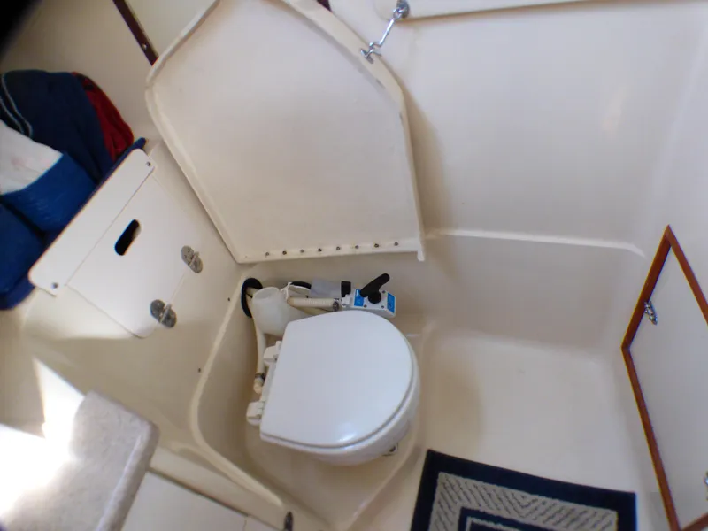 Interior of a 1998 Hunter 34 yacht, bathroom with toilet.