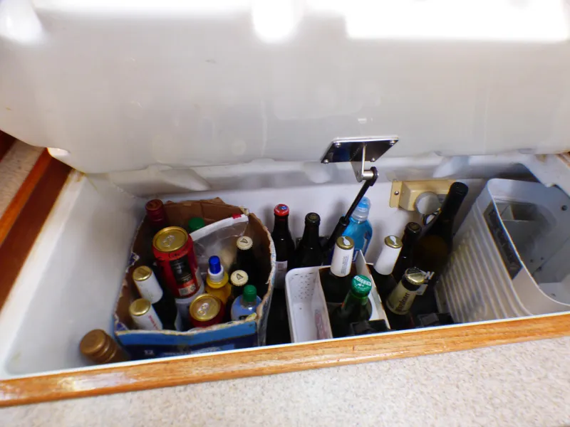 Beverage cooler in Hunter 34 boat, filled with bottles and cans.