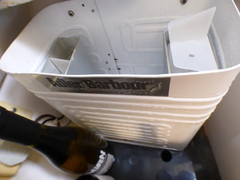 Interior of a 1998 Hunter 34 with bottle and compartment.