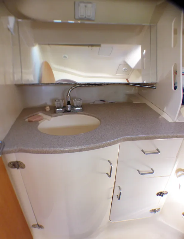 Interior of a 1998 Hunter 34 boat with sink and storage.