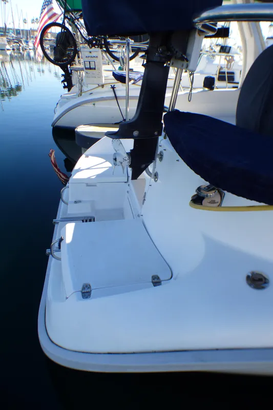 Stern of a 1998 Hunter 34 sailboat docked in marina.