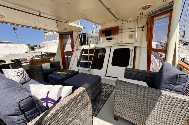 Luxurious 1988 Overseas PT52 Cockpit Motoryacht interior with comfortable seating and elegant decor.