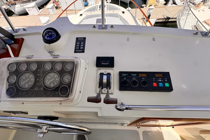 1988 Overseas PT52 Cockpit Motoryacht dashboard with controls and gauges.