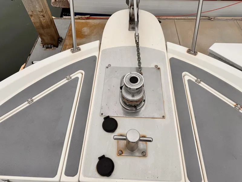1988 Overseas PT52 Cockpit Motoryacht deck with anchor winch and cleat.