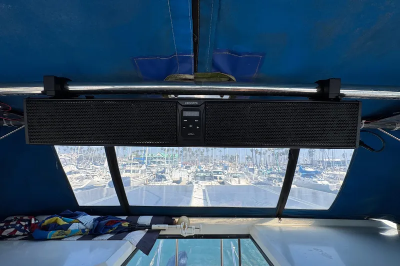 Soundbar installed on 1985 Carver 3607 Aft Cabin Motor Yacht, overlooking marina.