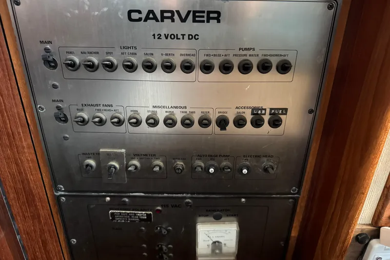 Control panel of 1985 Carver 3607 Aft Cabin Motor Yacht with switches and labels.