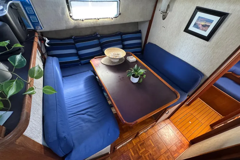 Interior of 1985 Carver 3607 Aft Cabin Motor Yacht with cozy dining area.