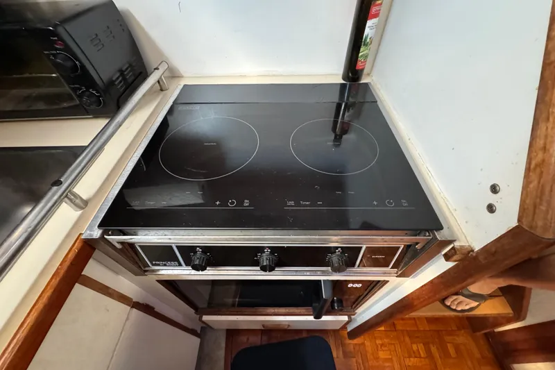 Induction cooktop in 1985 Carver 3607 Aft Cabin Motor Yacht kitchen.