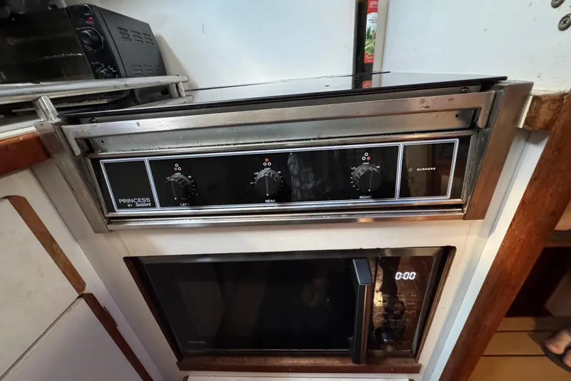 1985 Carver 3607 Aft Cabin Motor Yacht kitchen with Princess stove and microwave.
