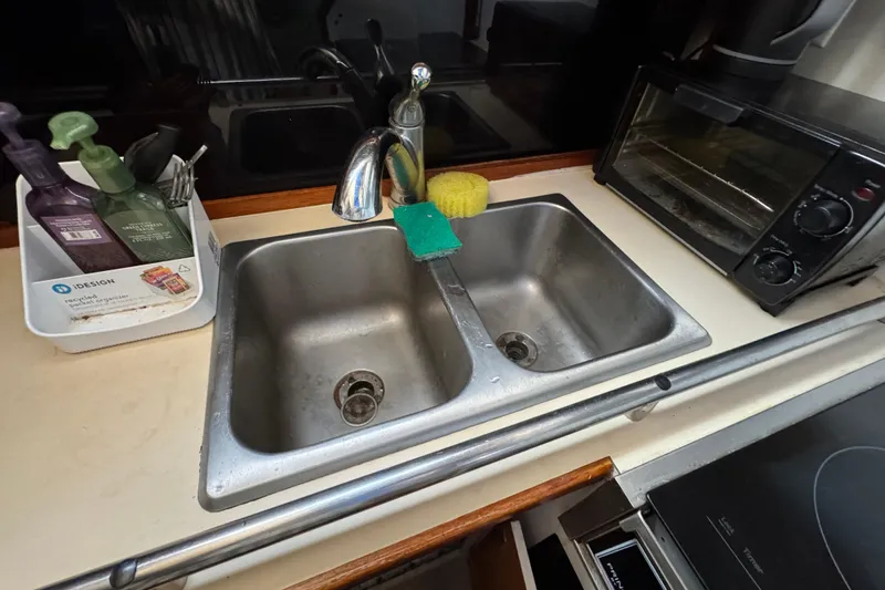 Kitchen sink area in 1985 Carver 3607 Aft Cabin Motor Yacht with toaster oven.