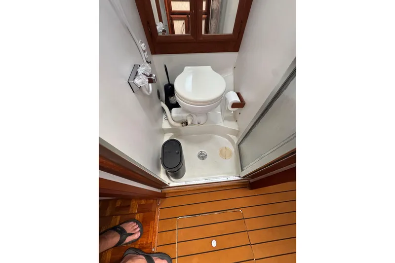 1985 Carver 3607 Aft Cabin Motor Yacht bathroom with toilet and shower.