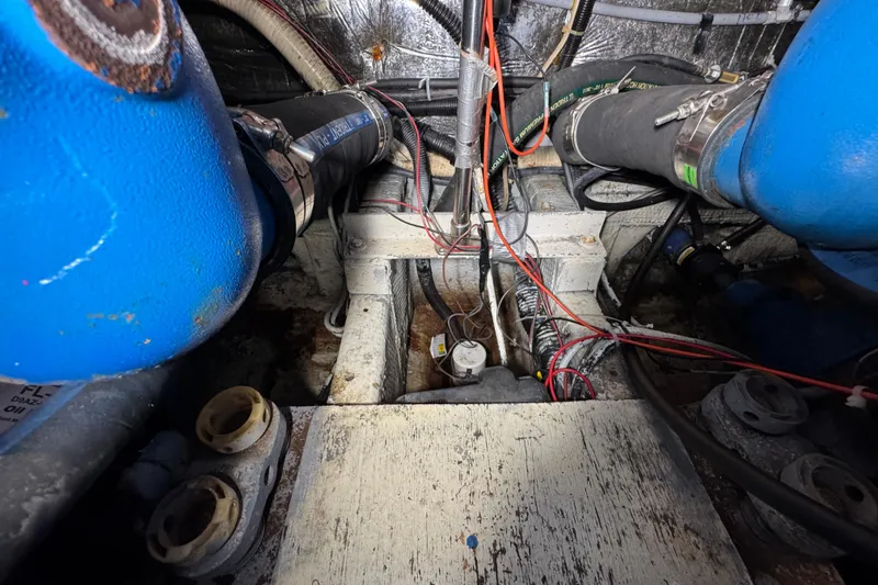 Engine room of 1985 Carver 3607 Aft Cabin Motor Yacht with visible wiring and components.