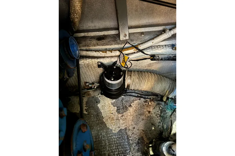Engine room of 1985 Carver 3607 Aft Cabin Motor Yacht, showing mechanical components.