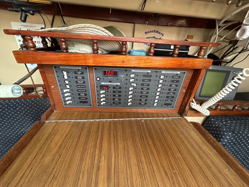 Electrical panel on a 1981 Catalina 30 sailboat, featuring switches and a digital display.